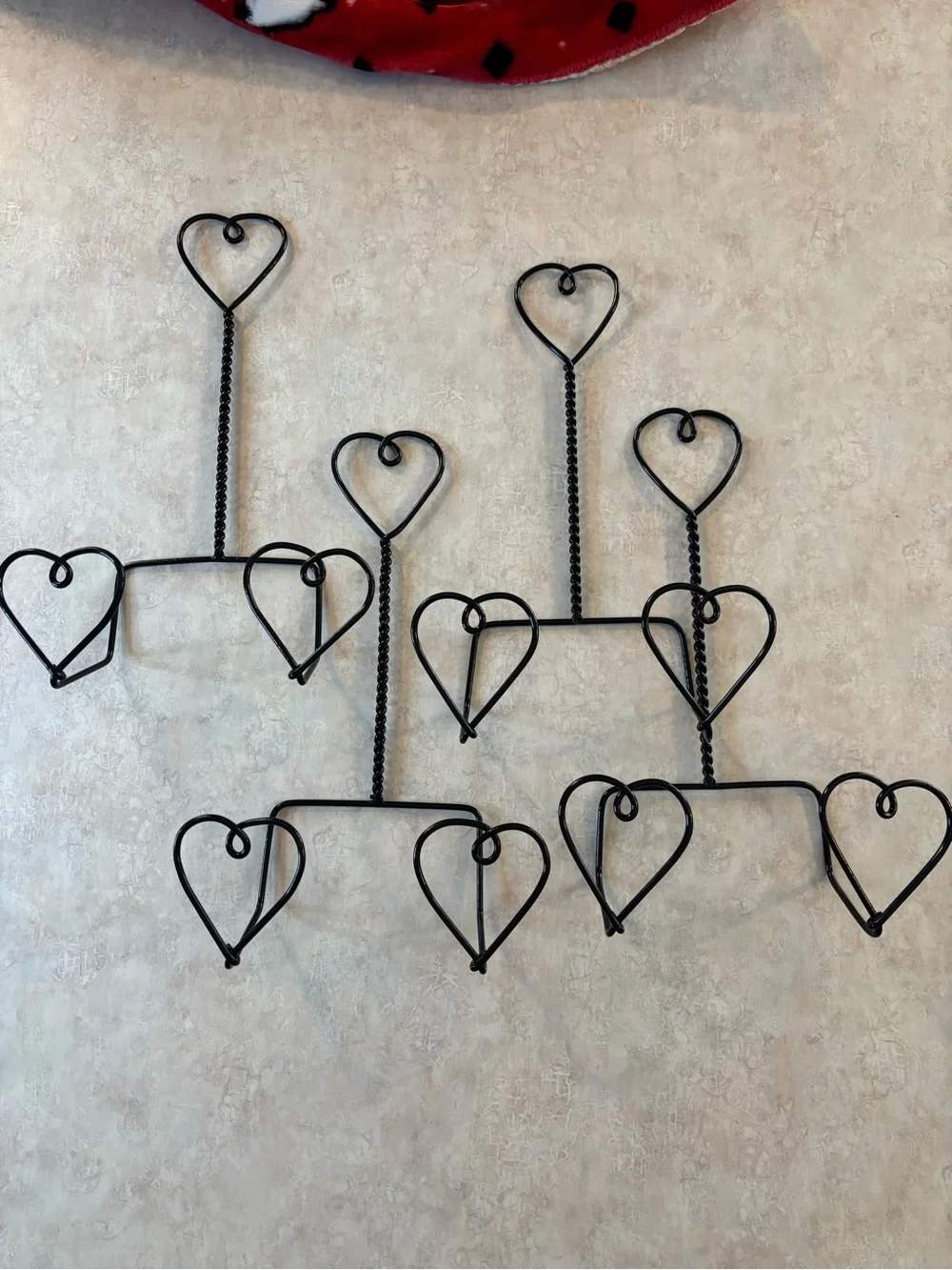 Set of 4 - black wire metal plate hangers.
